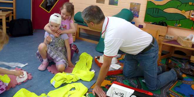 Anlegen eines Kopfverbandes